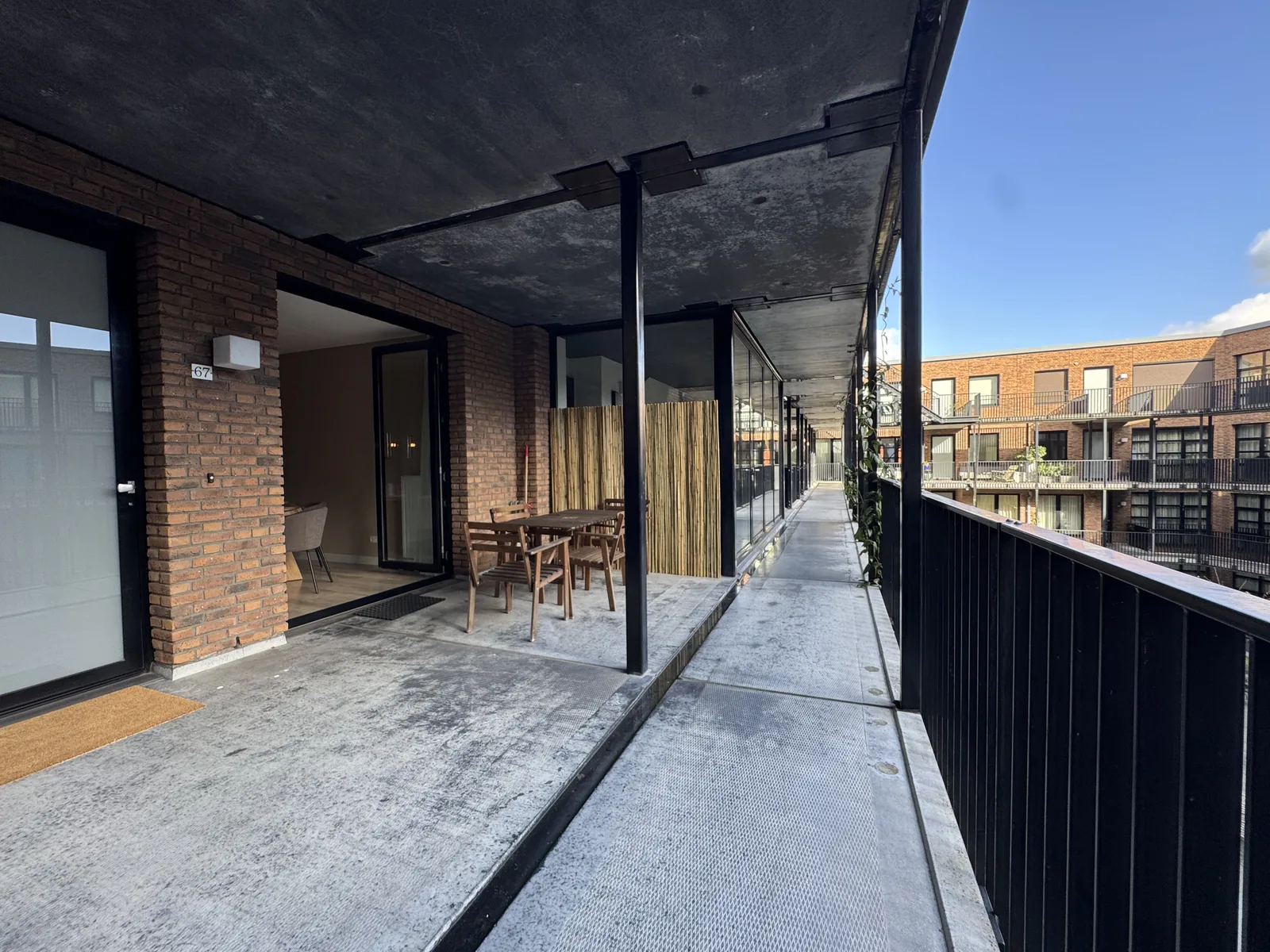 Gallery walkway and terrace of modern Utrecht apartment building showing contemporary architecture